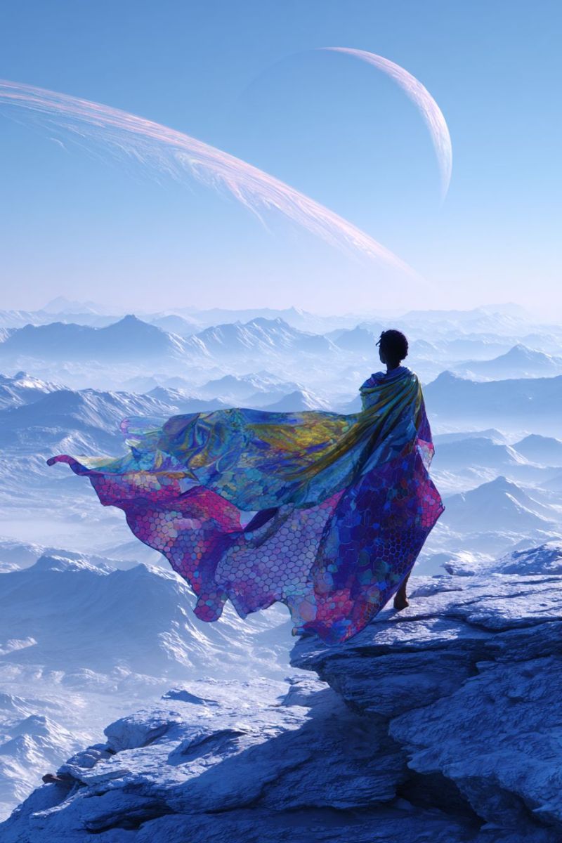 Mountain sky cloud horizon rock rocky cliff A person stands on a rocky cliff, their back turned, wearing a flowing, multicolored cape that billows in the wind. The cape is adorned with intricate patterns, including what appears to be a honeycomb design. The individual's hair is styled in a bun, and they are gazing towards the horizon. In the background, there are snow-capped mountains under a clear blue sky. Above the mountains, two celestial bodies are visible: a large planet with a visible ring system and a smaller, crescent-shaped moon. The sky is a deep blue, and the overall scene is serene and majestic.