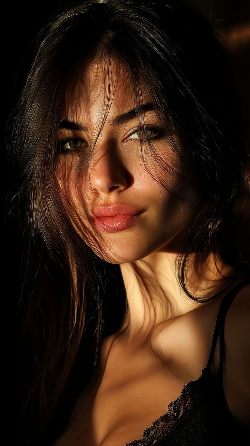 Femme visage oeil peau maquillage beaute glamour expression eclairage texture Un portrait rapproché d'une femme aux cheveux noirs et ondulés qui tombent sur ses épaules et son visage. Elle a un teint clair et porte un haut en dentelle noire qui laisse apparaître sa clavicule. Ses yeux sont en forme d'amande et légèrement fermés, avec de longs cils foncés. Ses lèvres sont pleines et légèrement entrouvertes, et elle a un grain de beauté sur sa joue droite. Le fond est sombre, et l'éclairage est concentré sur son visage, créant un effet dramatique.